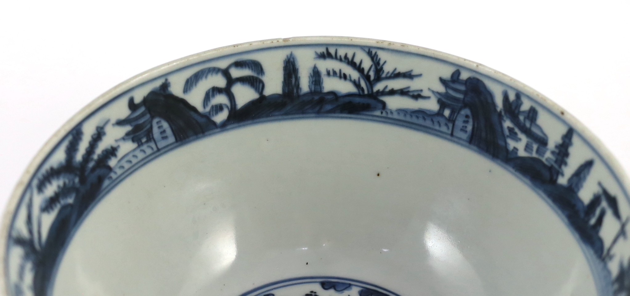 A Chinese Ming blue and white ‘lotus pond’ deep bowl, 21.5cm diameter, 10.5cm high, hairline crack to rim